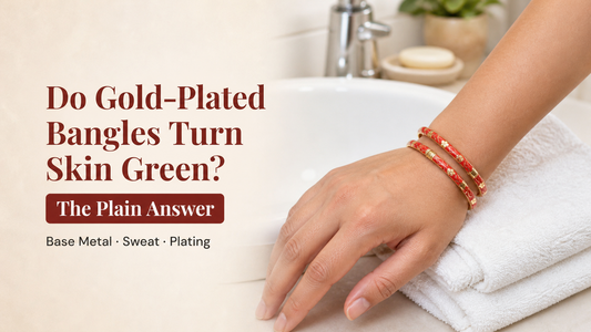 Gold-plated Rangat bangles worn on the wrist near a washbasin