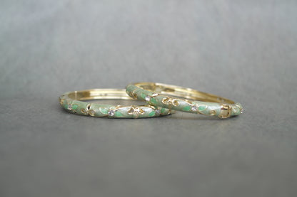 Chandni enamel bangle by Rangat — green enamel flows through intricate gold work and stone detailing