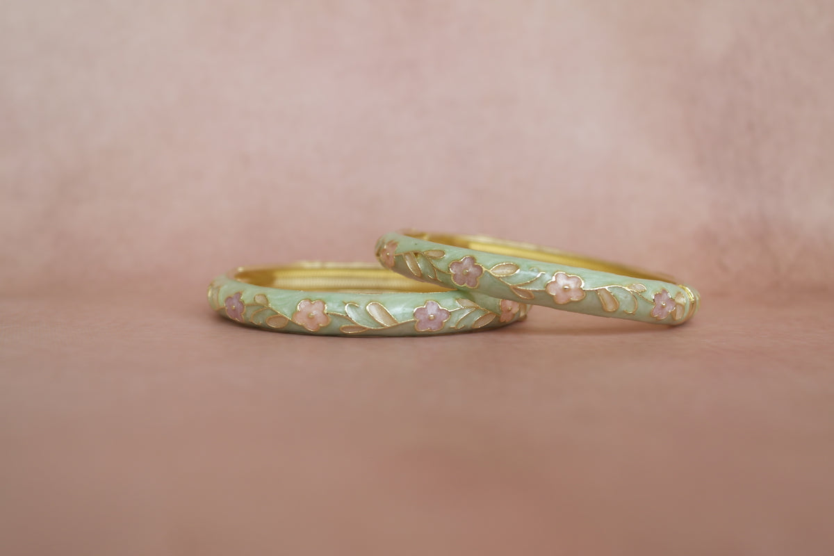 Rangoli enamel bangle by Rangat — soft floral notes in green