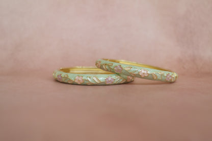 Rangoli enamel bangle by Rangat — soft floral notes in green